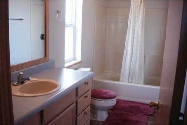 5131 Lateral A Road Wapato, WA 98951 - Photo 6 of 7 a bathroom with a sink toilet and window