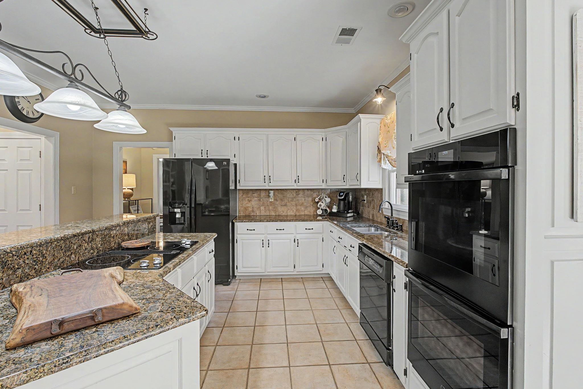 337 Revell Cove Collierville, TN 38017 - Photo 14 of 40 a kitchen with a sink stove and refrigerator