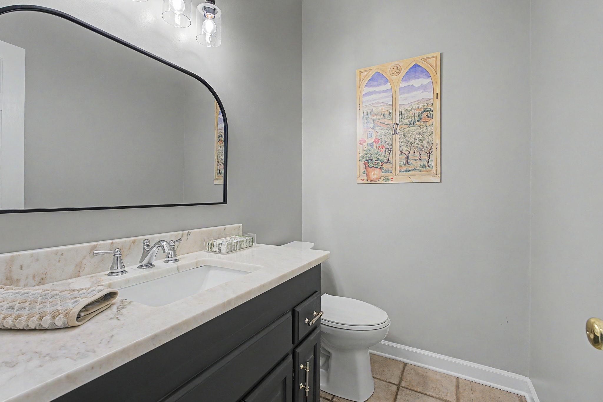337 Revell Cove Collierville, TN 38017 - Photo 19 of 40 a bathroom with a granite countertop sink mirror vanity and toilet