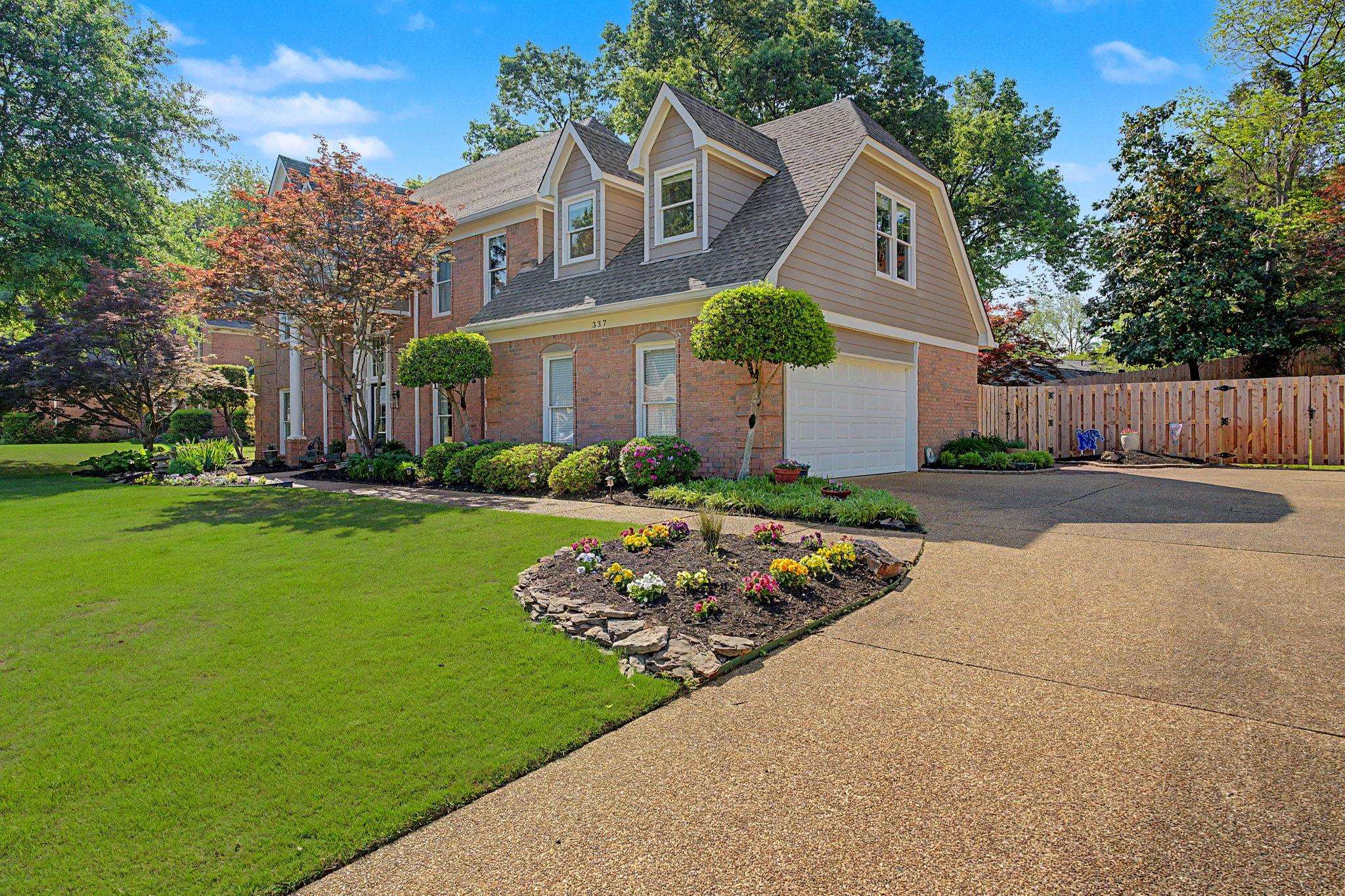 337 Revell Cove Collierville, TN 38017 - Photo 2 of 40 a front view of a house with garden