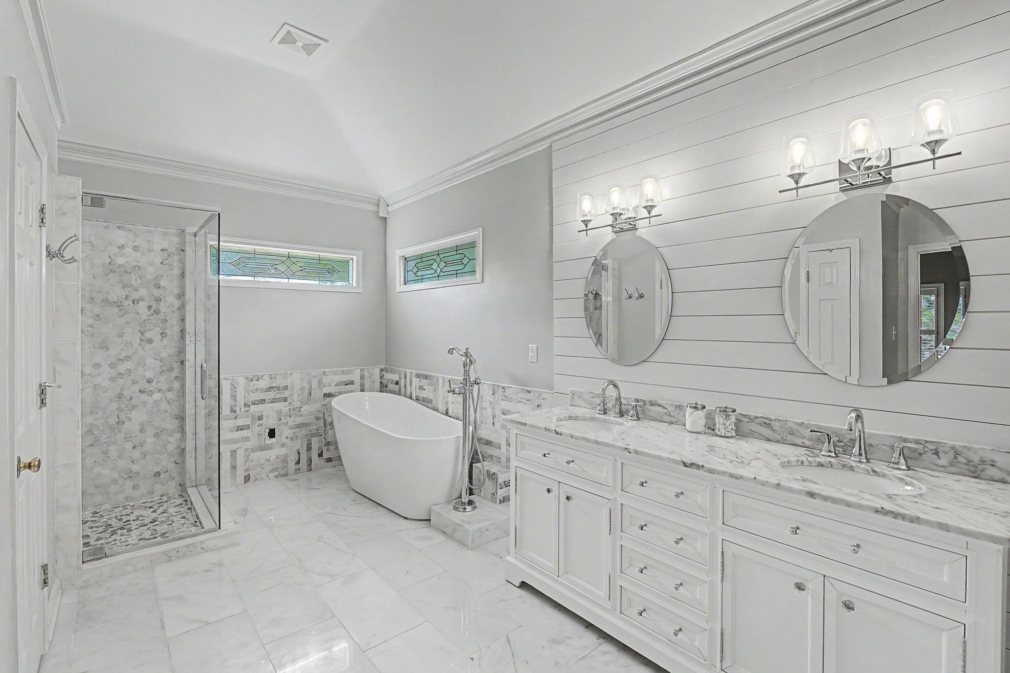 337 Revell Cove Collierville, TN 38017 - Photo 21 of 40 a spacious bathroom with a double vanity sink mirror and bathtub