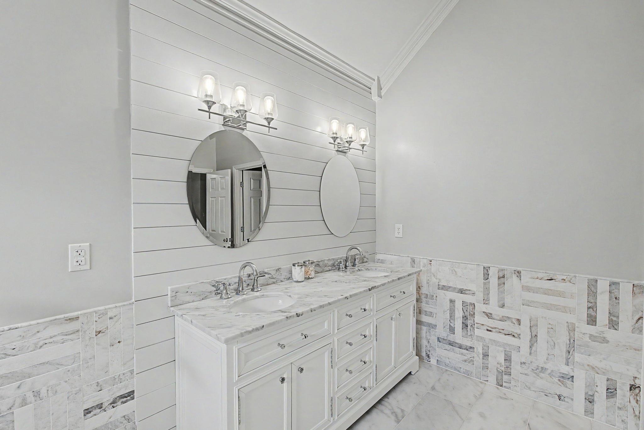 337 Revell Cove Collierville, TN 38017 - Photo 24 of 40 a bathroom with a double vanity sink and a mirror