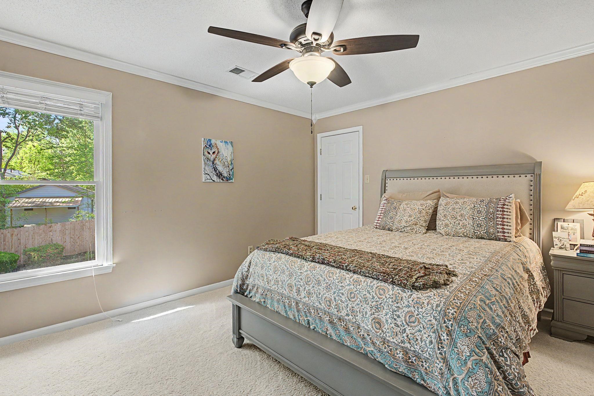 337 Revell Cove Collierville, TN 38017 - Photo 25 of 40 a bedroom with a large bed and a window
