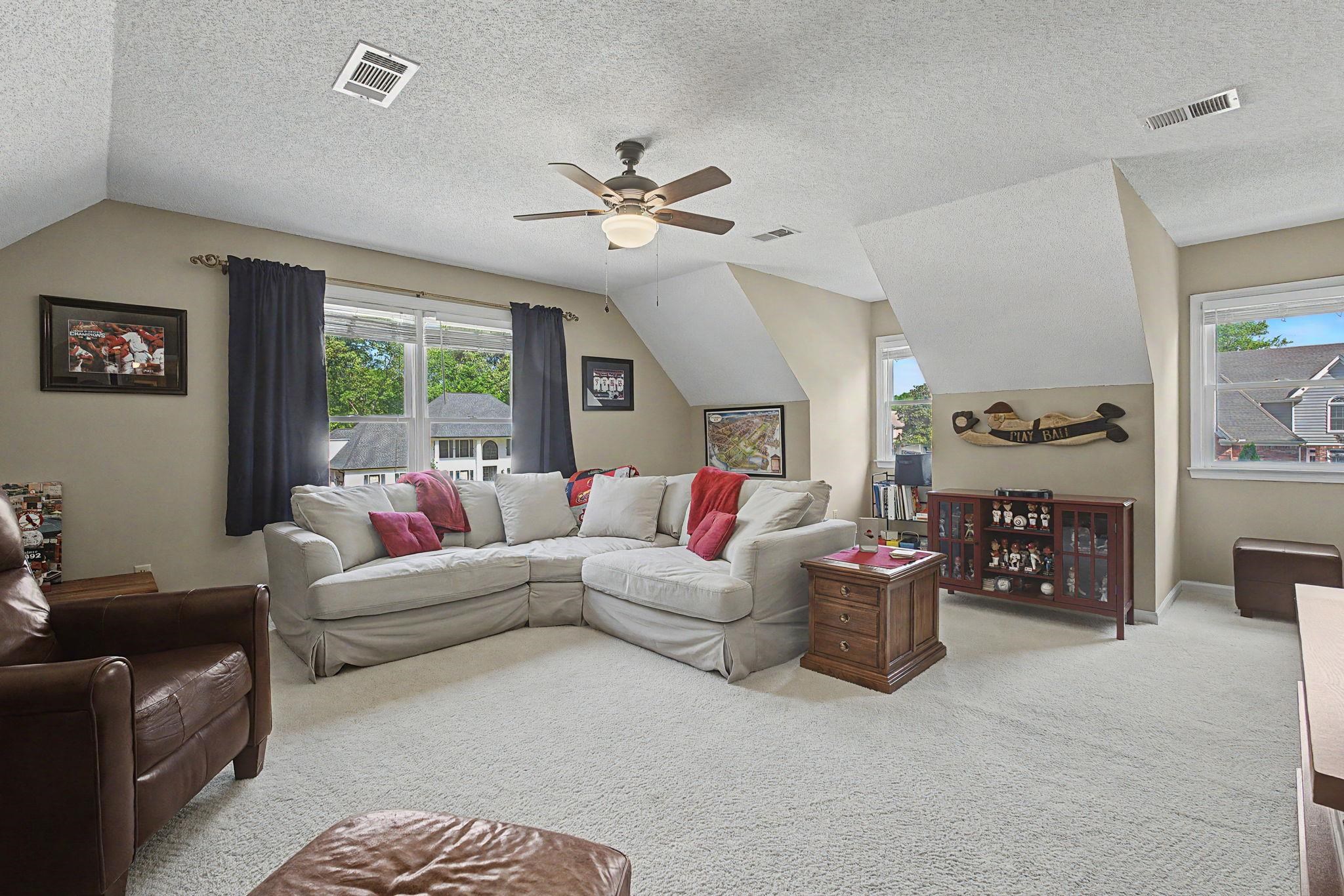 337 Revell Cove Collierville, TN 38017 - Photo 27 of 40 a living room with fireplace furniture and a chandelier