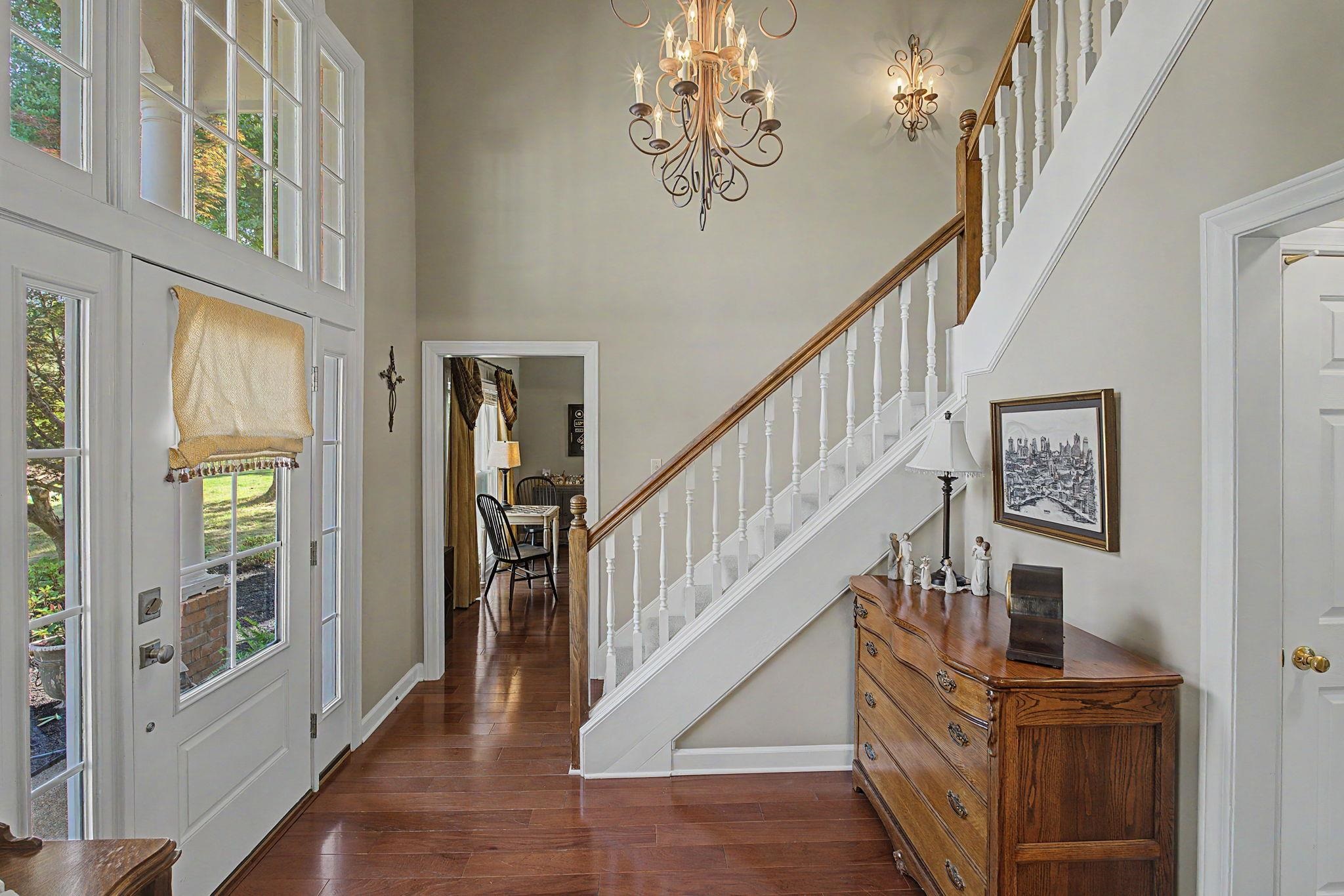 337 Revell Cove Collierville, TN 38017 - Photo 6 of 40 a view of entryway and hall with wooden floor
