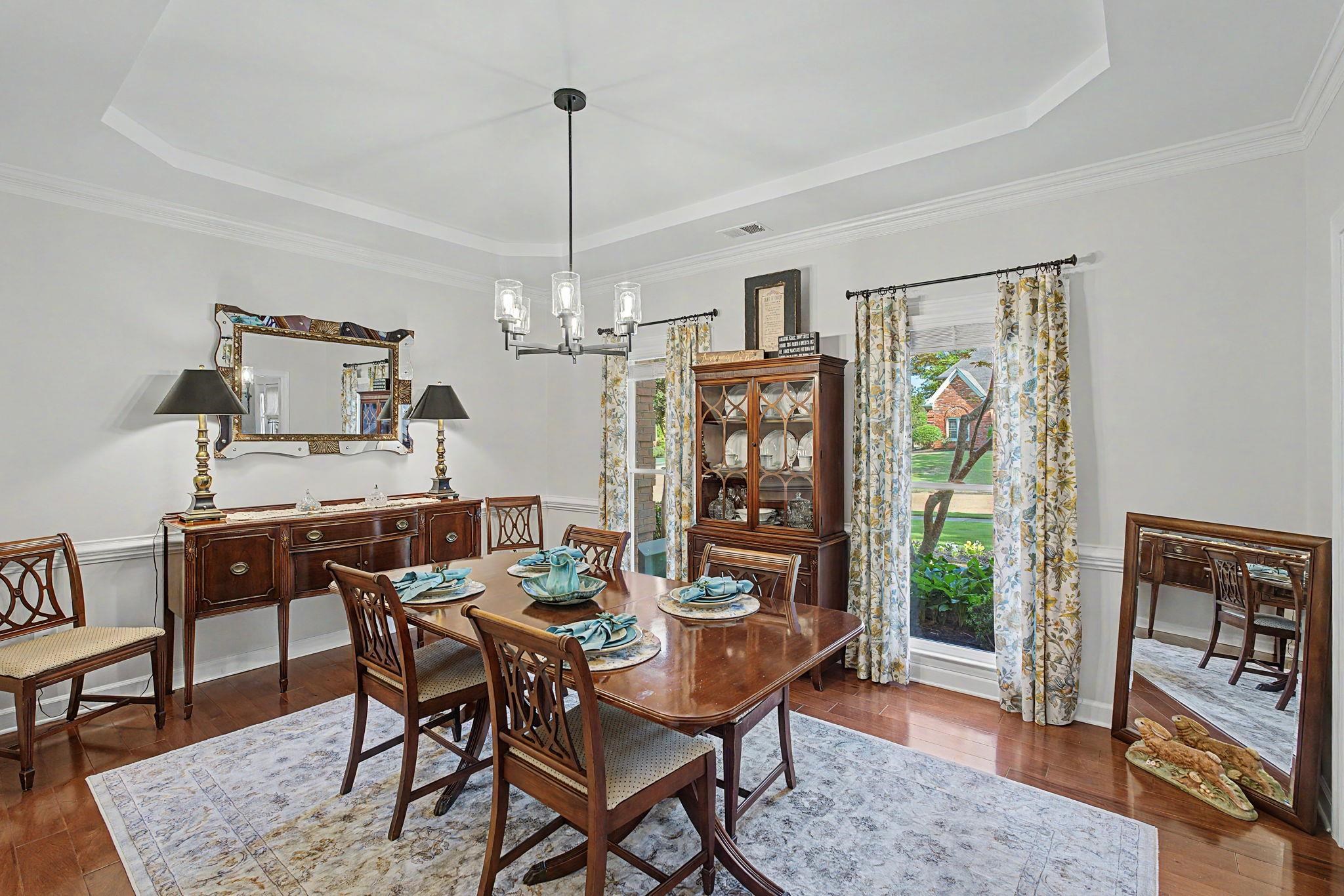 337 Revell Cove Collierville, TN 38017 - Photo 7 of 40 a view of a dining room with furniture window and wooden floor