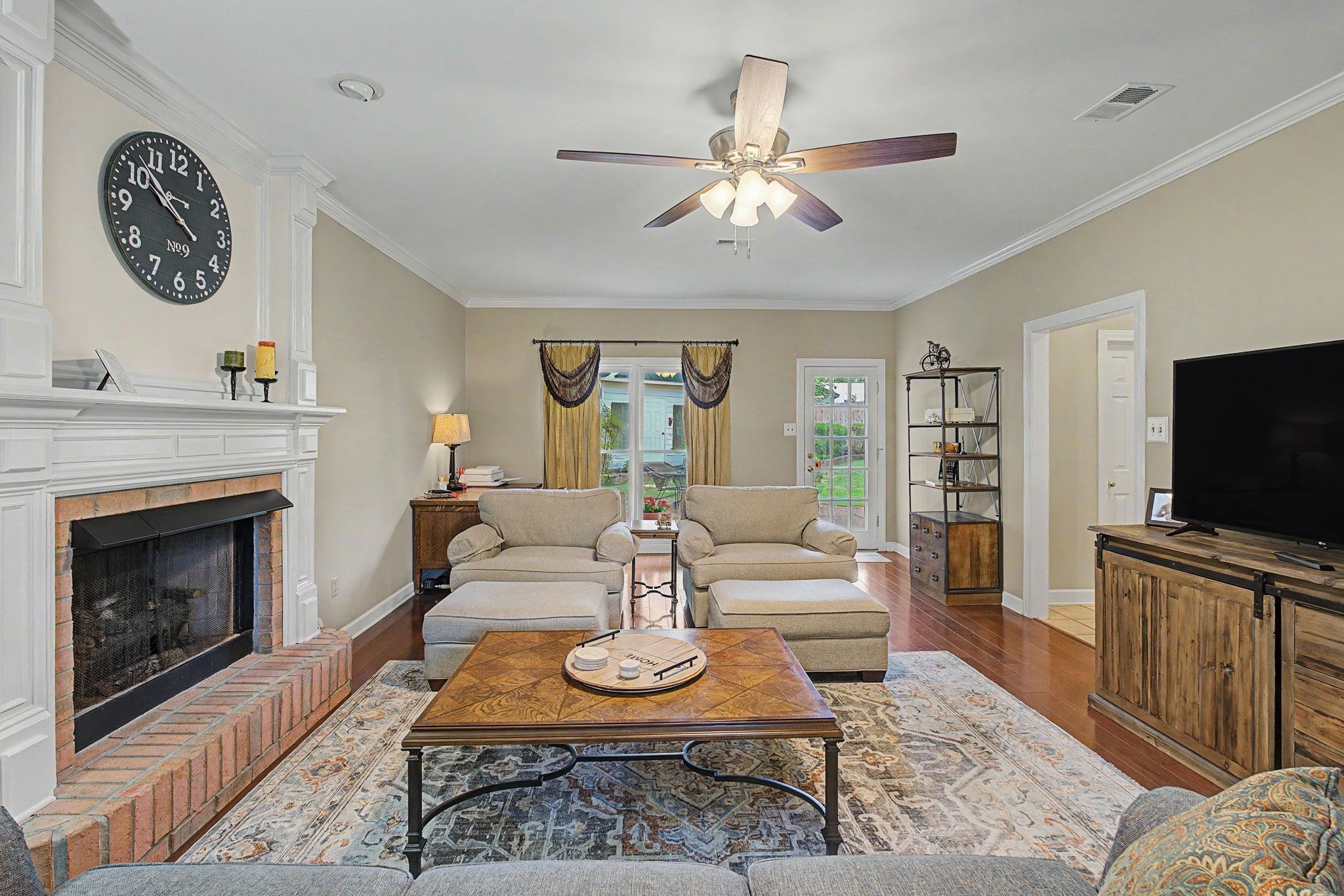 337 Revell Cove Collierville, TN 38017 - Photo 9 of 40 a living room with furniture a rug and a flat screen tv
