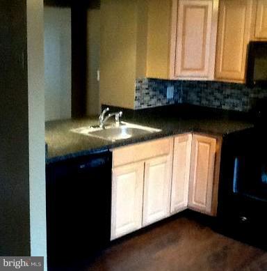 1320 Apple Ridge Court Edgewood, MD 21040 - Photo 7 of 26 a bathroom with a granite countertop sink and a mirror