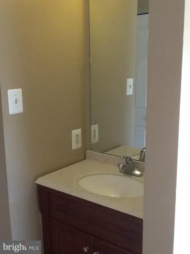 1320 Apple Ridge Court Edgewood, MD 21040 - Photo 10 of 26 a bathroom with a sink and a mirror