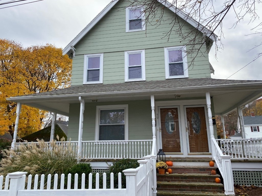 90 Russell Street, Unit 90 Melrose, MA 02176 - Photo 1 of 9 a front view of a house with a porch