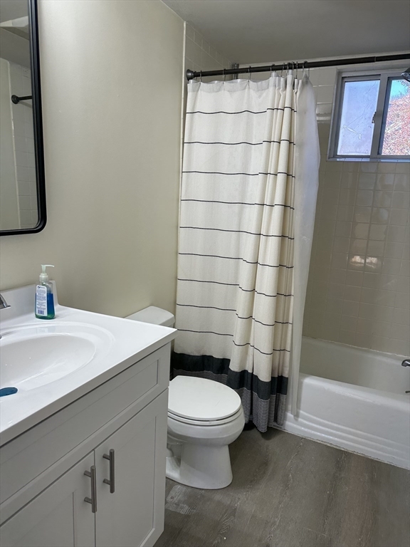 90 Russell Street, Unit 90 Melrose, MA 02176 - Photo 7 of 9 a bathroom with a sink a toilet and shower