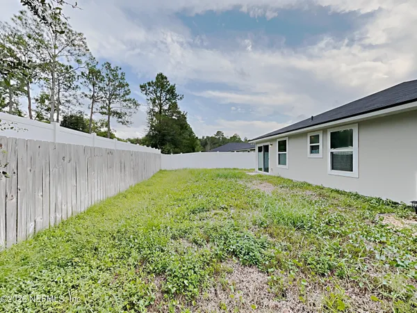 a house with trees in the background