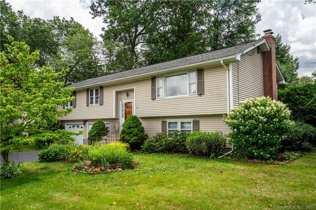 148 Rutledge Road Wethersfield, CT 06109 - Photo 1 of 1 a house that has a lot of plants in it