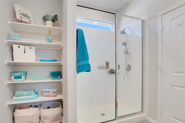 a front view of a house with a garden and plants