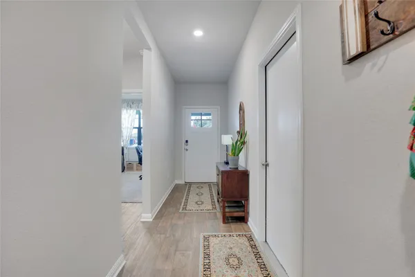 a kitchen with granite countertop stainless steel appliances a refrigerator a stove a microwave and cabinets