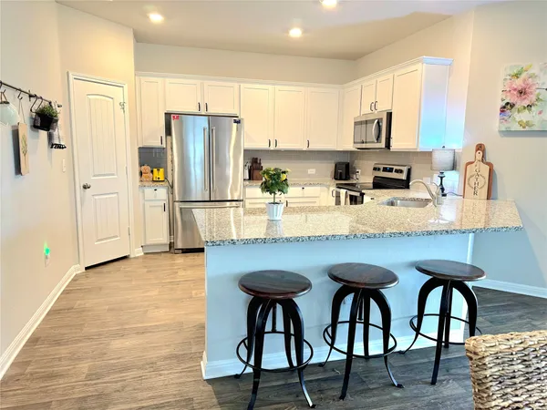 a bathroom with double sink and a mirror