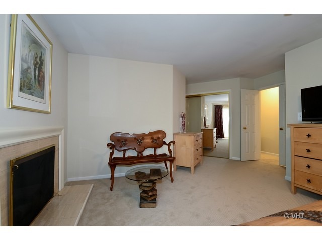 15 Landmark Street Northfield, IL 60093 - Photo 11 of 22 a living room with furniture and a flat screen tv
