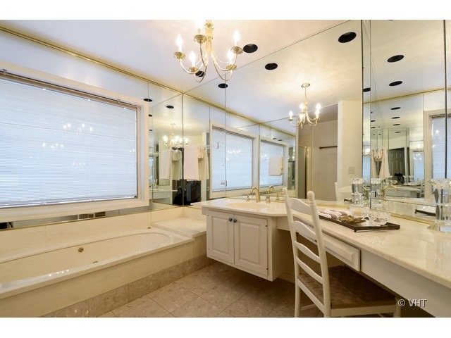 15 Landmark Street Northfield, IL 60093 - Photo 12 of 22 a bathroom with a sink double vanity granite and a large mirror