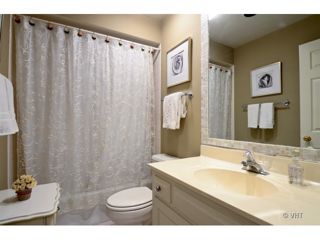 15 Landmark Street Northfield, IL 60093 - Photo 15 of 22 a bathroom with a sink toilet and shower