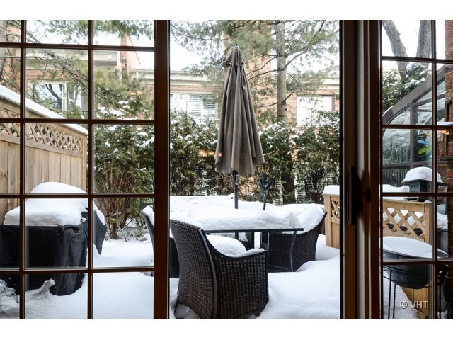 15 Landmark Street Northfield, IL 60093 - Photo 17 of 22 a dining room with a large window and chairs