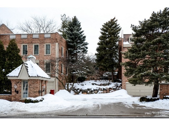 15 Landmark Street Northfield, IL 60093 - Photo 18 of 22 a view of a house with a yard covered in snow