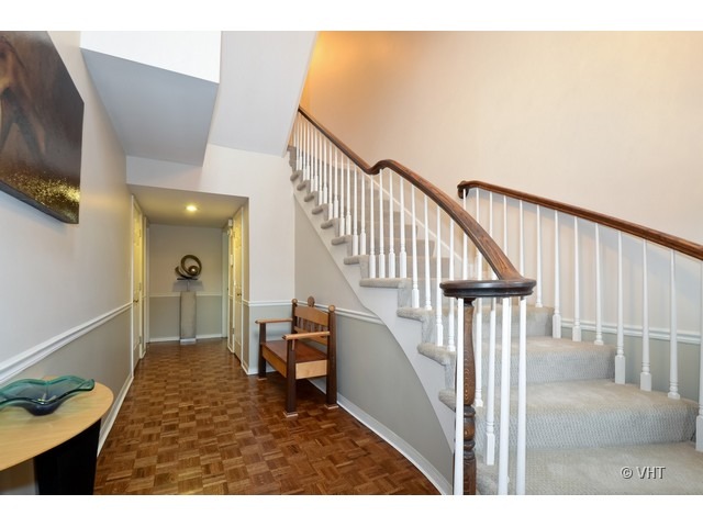 15 Landmark Street Northfield, IL 60093 - Photo 2 of 22 a view of entryway and hall with wooden floor
