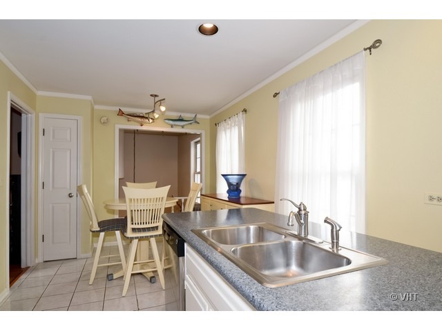 15 Landmark Street Northfield, IL 60093 - Photo 6 of 22 a kitchen with granite countertop a sink and cabinets
