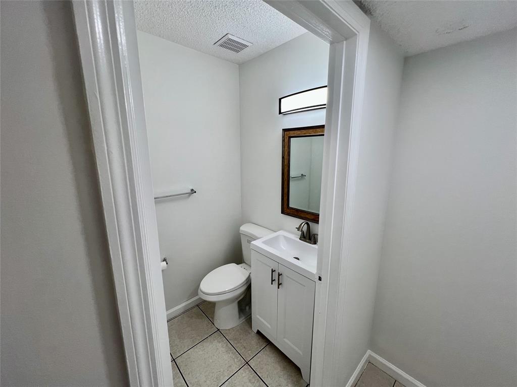14156 Southwest 179th Terrace Miami, FL 33177 - Photo 11 of 37 a bathroom with a toilet and a sink