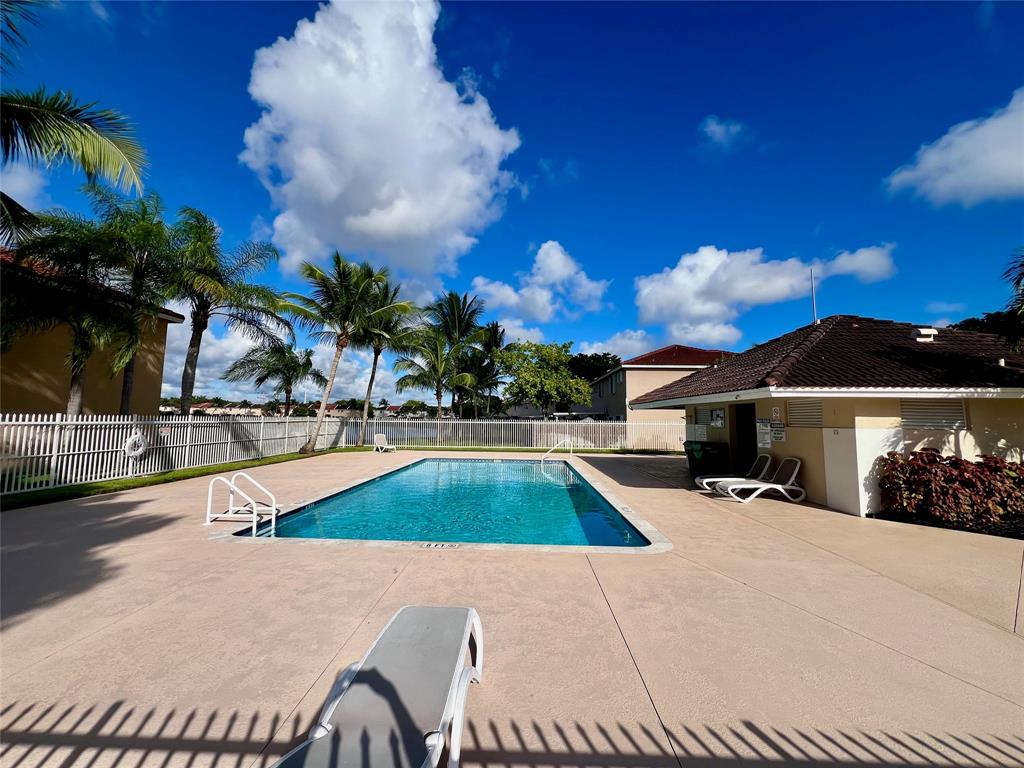 14156 Southwest 179th Terrace Miami, FL 33177 - Photo 32 of 37 a view of a house with swimming pool and sitting area