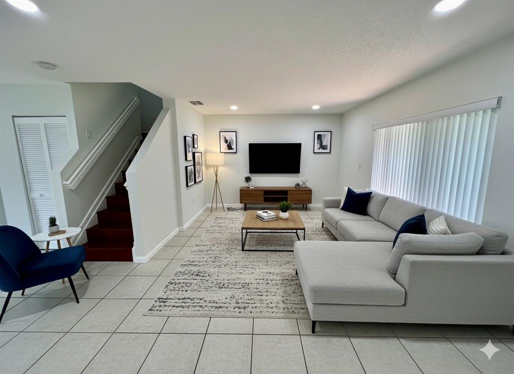 14156 Southwest 179th Terrace Miami, FL 33177 - Photo 5 of 37 a living room with furniture and a flat screen tv