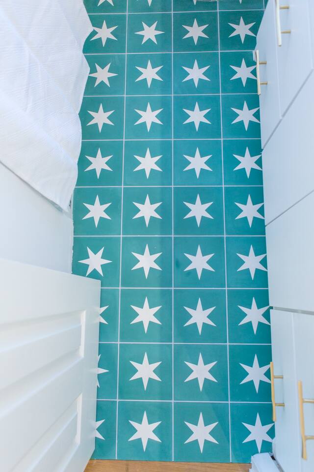 1913 Rabb Road, Unit B Austin, TX 78704 - Photo 8 of 10 Star-patterned tile flooring adds a playful, colorful touch to this well-appointed space.