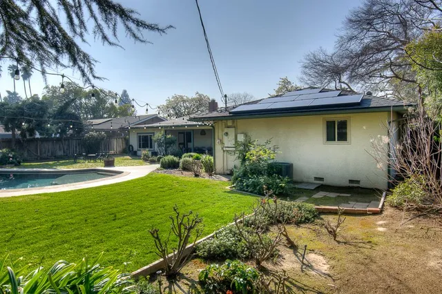 a view of a swimming pool with a patio