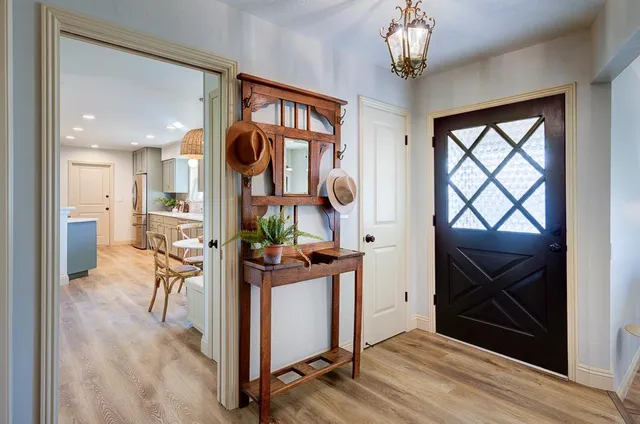 a view of a hallway and dining room