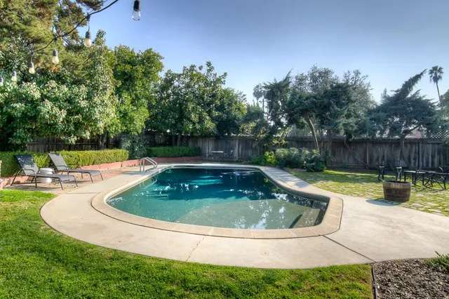 a view of swimming pool having outdoor seating