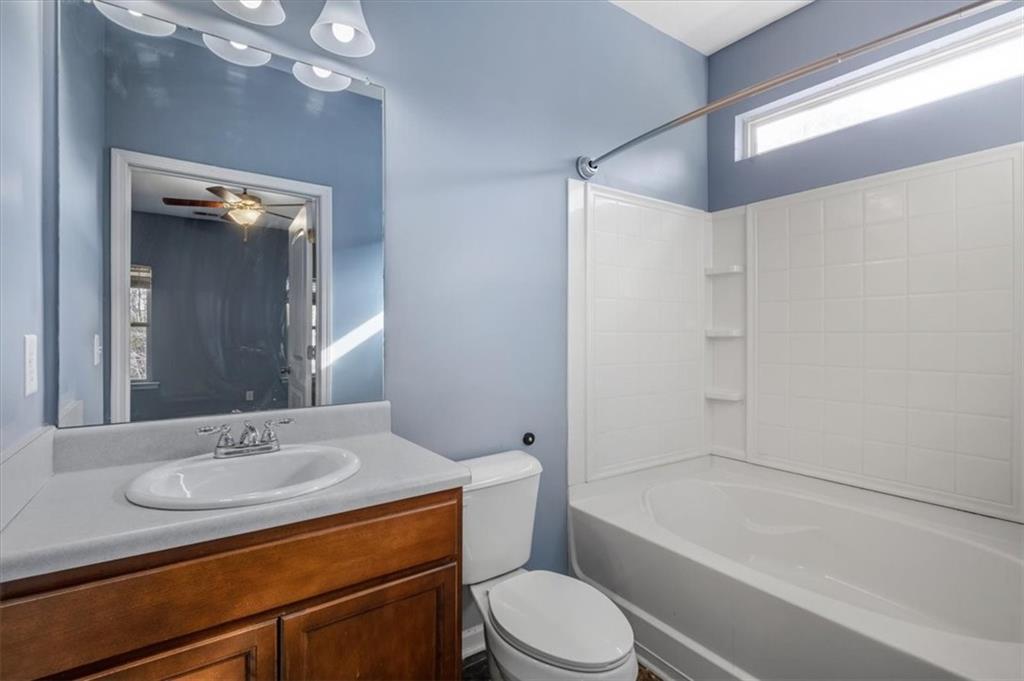 15 Grandberry Court Rome, GA 30165 - Photo 20 of 23 a bathroom with a granite countertop sink toilet mirror and bathtub