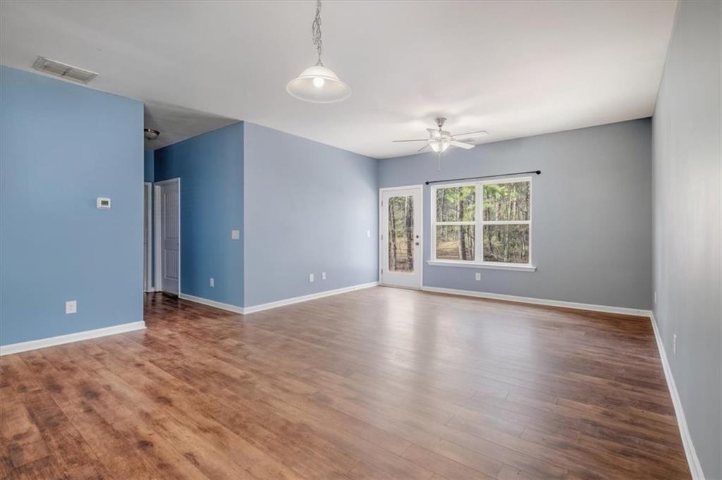 15 Grandberry Court Rome, GA 30165 - Photo 7 of 23 wooden floor in an empty room with a window