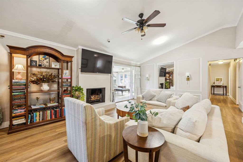 3284 Golfing Green Drive Farmers Branch, TX 75234 - Photo 6 of 25 a living room with furniture a fireplace and a flat screen tv