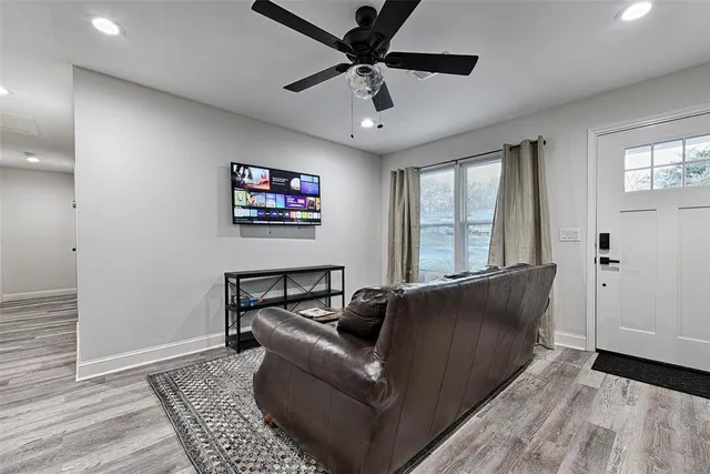 a living room with furniture and a window