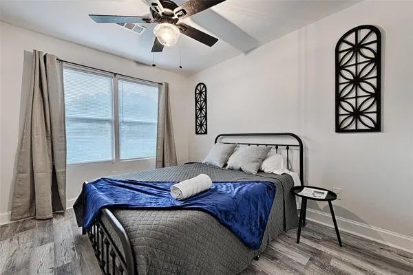 a bedroom with a bed and a window