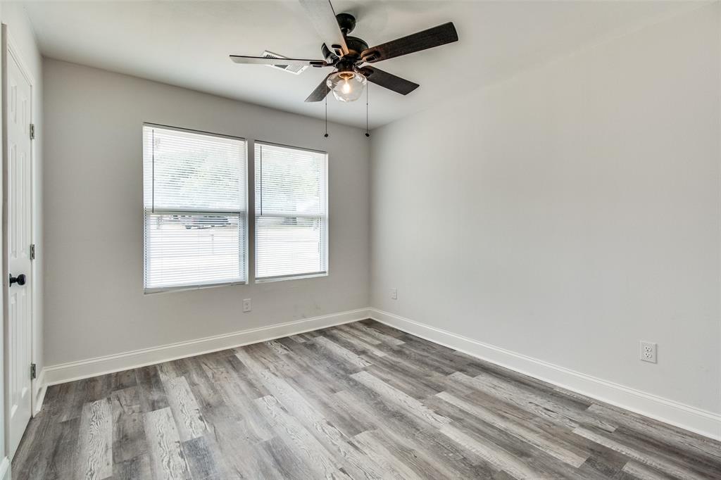 1201 Ridgewood Road Denison, TX 75020 - Photo 22 of 29 wooden floor in an empty room with a window