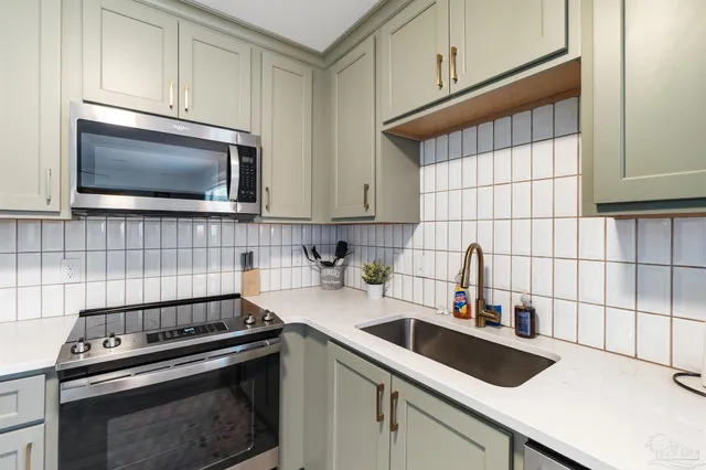 a view of a hallway with washer and dryer