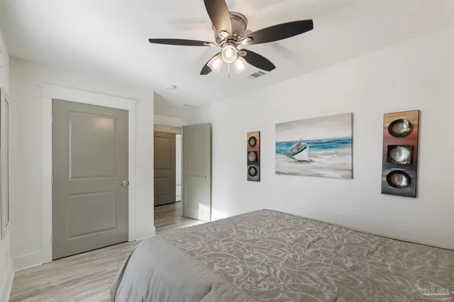 a bedroom with furniture and a window