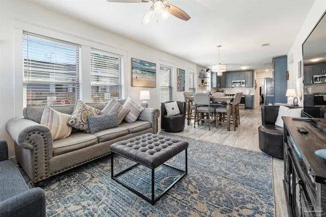 a living room with furniture and windows