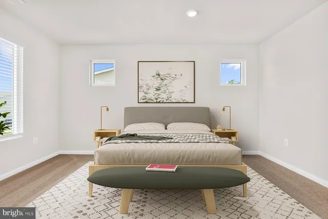 a bedroom with bed and a window