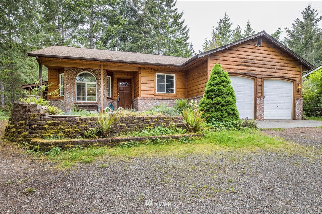 20 East Rd Of Tralee Shelton, WA 98584 - Photo 1 of 18 a front view of a house with garden