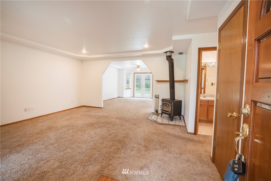 20 East Rd Of Tralee Shelton, WA 98584 - Photo 4 of 18 a view of a room with gym equipment and a large window