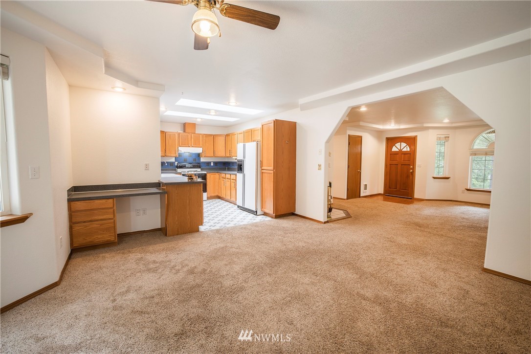 20 East Rd Of Tralee Shelton, WA 98584 - Photo 9 of 18 an empty room with chandelier fan and windows