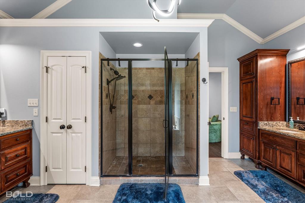 2220 Forest Hills Boulevard Haughton, LA 71037 - Photo 30 of 40 Walk-in shower with clear glass enclosure and tiled walls