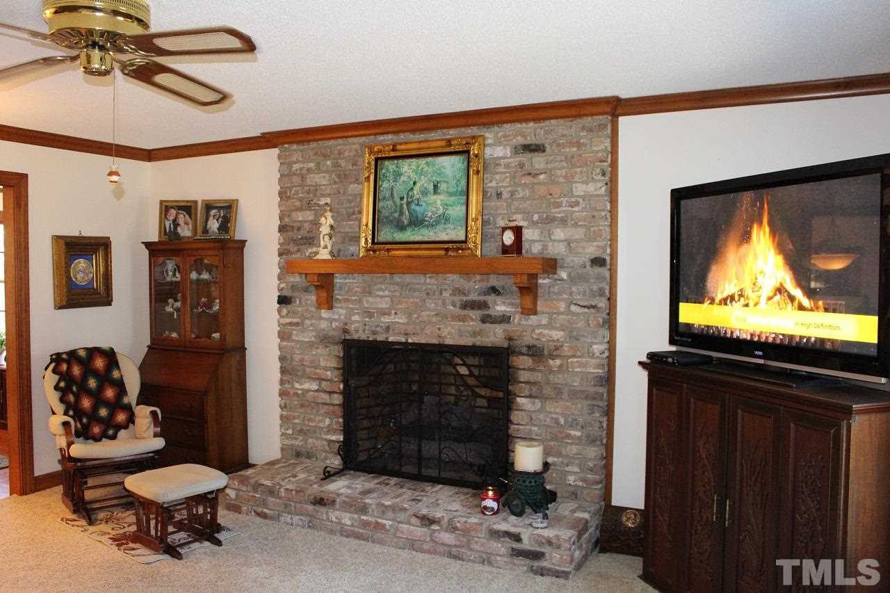 8709 Campfire Trail Raleigh, NC 27615 - Photo 11 of 25 a living room with furniture and a fireplace