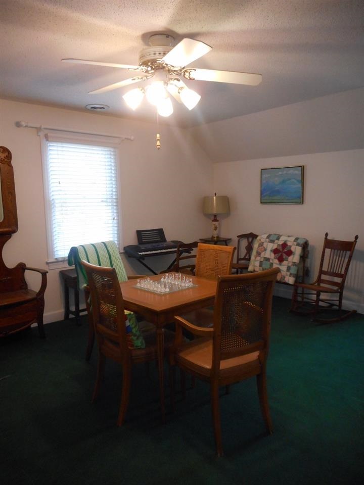 8709 Campfire Trail Raleigh, NC 27615 - Photo 16 of 25 a view of a dining room with furniture and a livingroom